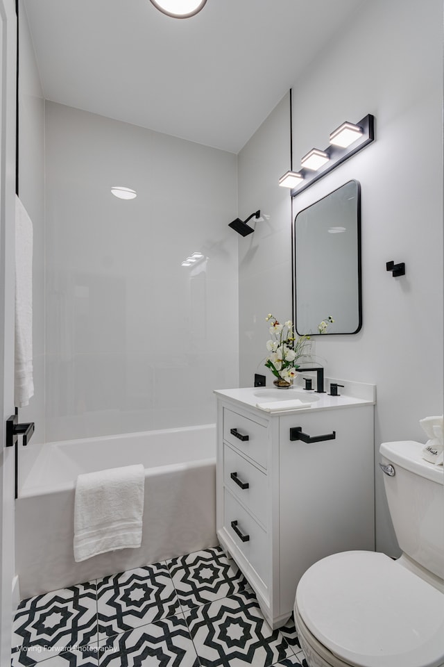 full bathroom with vanity, bathtub / shower combination, toilet, and tile patterned flooring