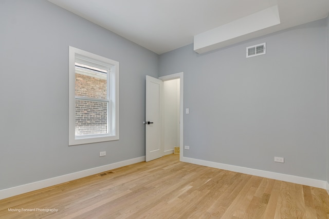 empty room with light wood-type flooring