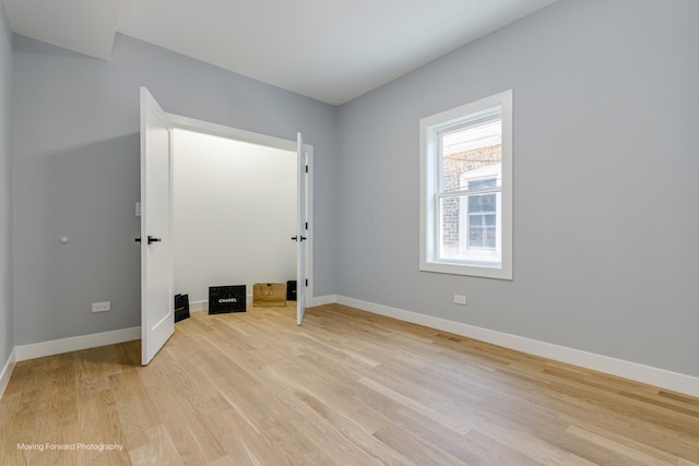 unfurnished room featuring light hardwood / wood-style floors