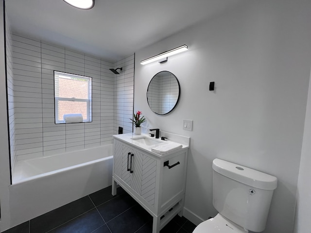 full bathroom featuring tiled shower / bath, vanity, toilet, and tile patterned floors