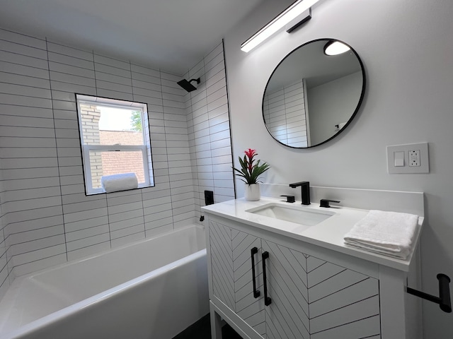 bathroom with vanity and tiled shower / bath