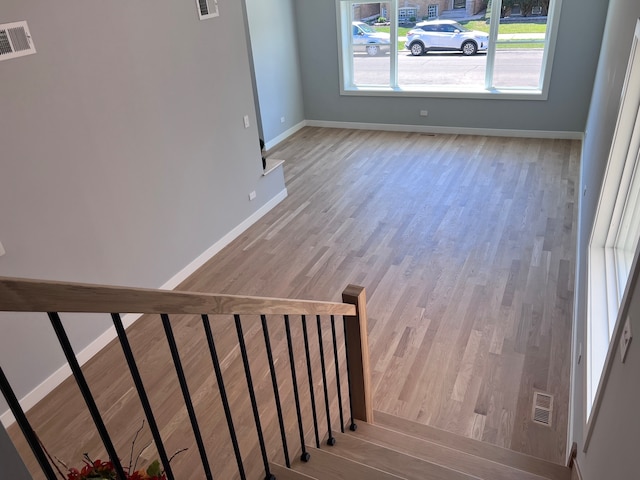 stairway featuring wood-type flooring