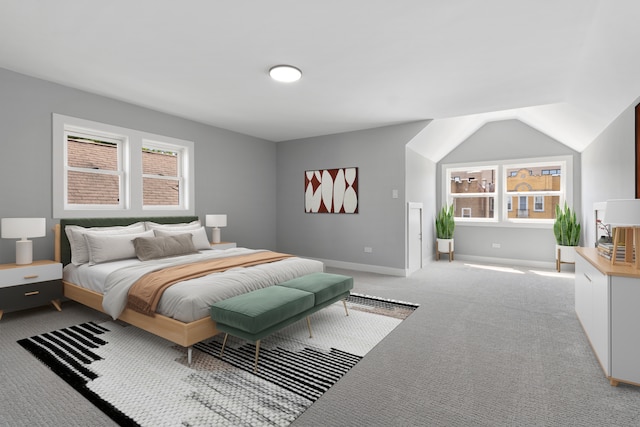 bedroom featuring multiple windows, light colored carpet, and lofted ceiling