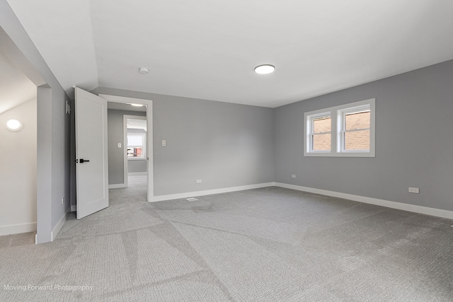 unfurnished bedroom featuring light colored carpet