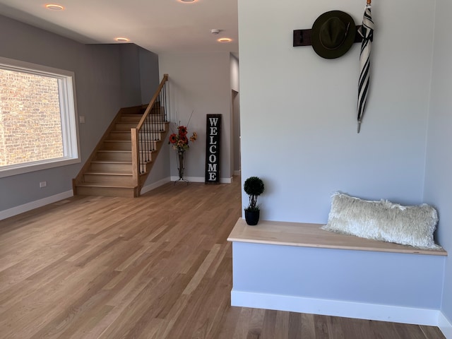 stairs featuring hardwood / wood-style flooring