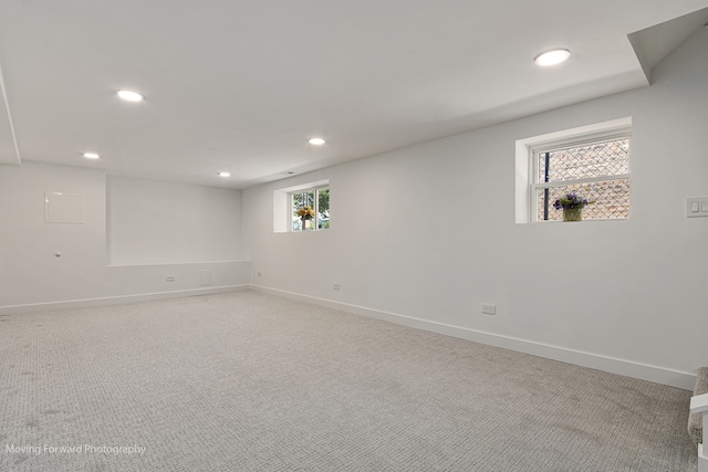 unfurnished room featuring a healthy amount of sunlight and carpet