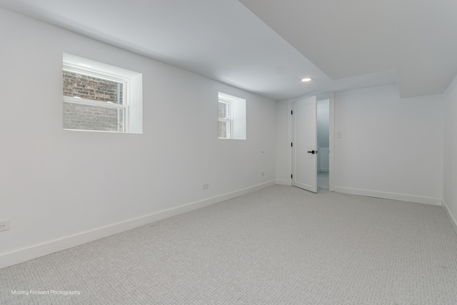 spare room featuring light carpet and a healthy amount of sunlight