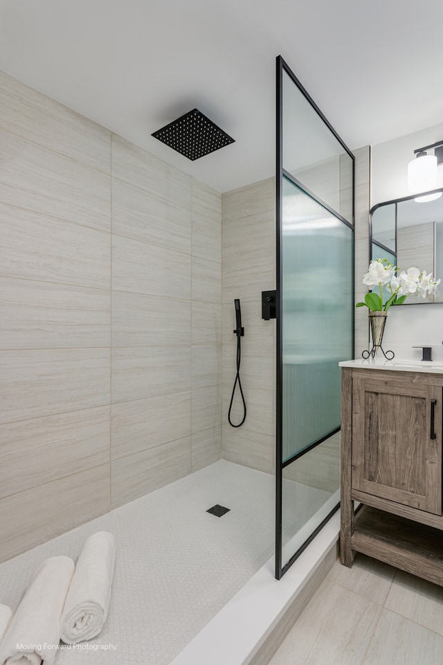 bathroom featuring a tile shower and tile patterned floors