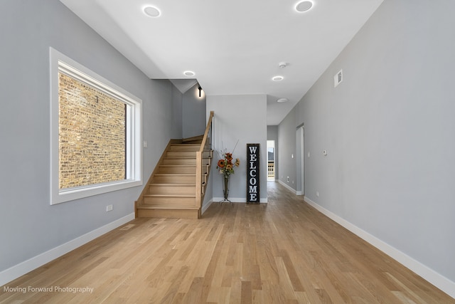 staircase featuring wood-type flooring