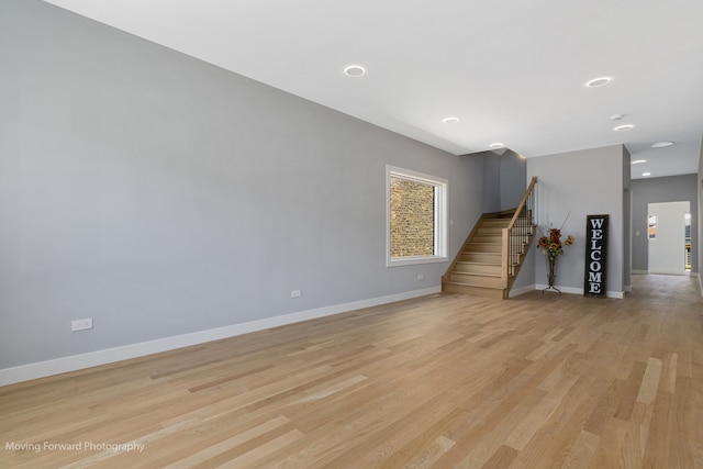 unfurnished living room with light hardwood / wood-style flooring