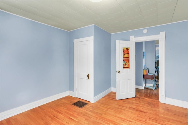 spare room featuring light hardwood / wood-style floors