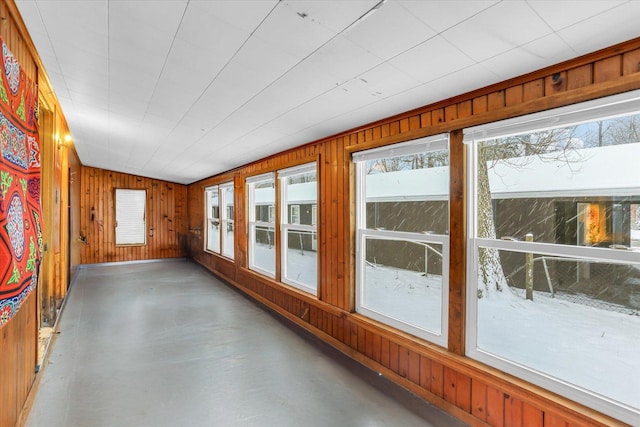 unfurnished sunroom with vaulted ceiling