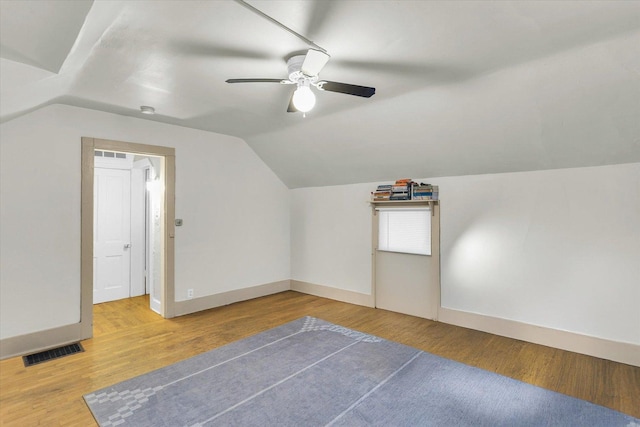 bonus room featuring hardwood / wood-style floors, vaulted ceiling, and ceiling fan