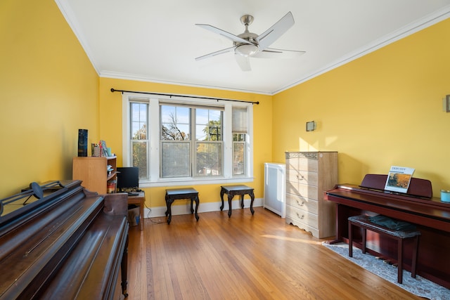 miscellaneous room featuring crown molding, hardwood / wood-style flooring, and ceiling fan