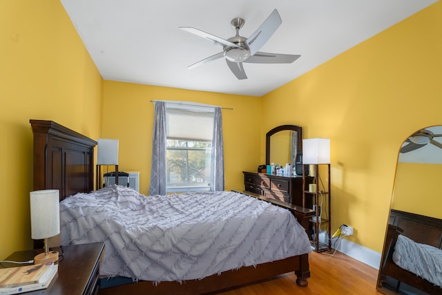 bedroom with hardwood / wood-style flooring and ceiling fan