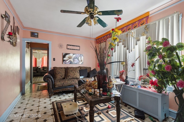 living room featuring ceiling fan and radiator