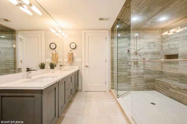 bathroom with vanity, tile patterned floors, and a shower with shower door