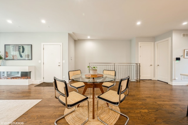 dining room with dark wood-type flooring