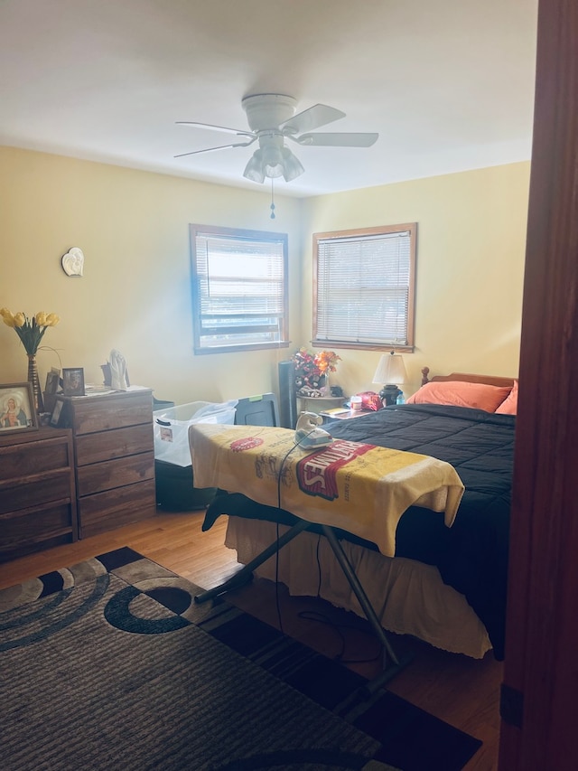 bedroom featuring wood-type flooring and ceiling fan