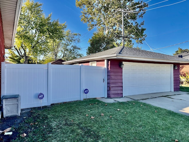 view of home's exterior with a yard and a garage