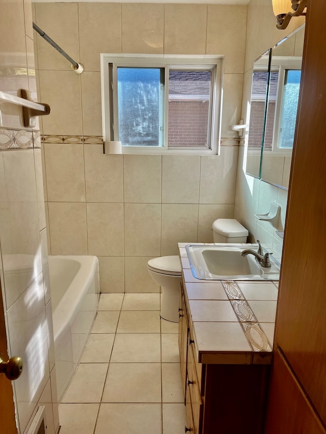 full bathroom featuring tile patterned floors, toilet, shower / tub combination, vanity, and tile walls