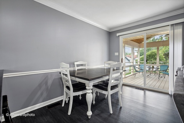 dining space featuring ornamental molding and wood-type flooring