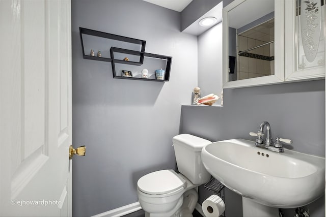 bathroom with toilet and sink