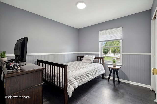 bedroom featuring dark hardwood / wood-style flooring