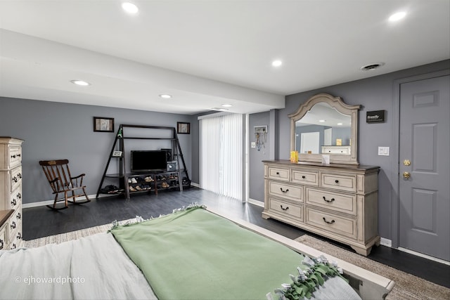 bedroom featuring dark hardwood / wood-style flooring