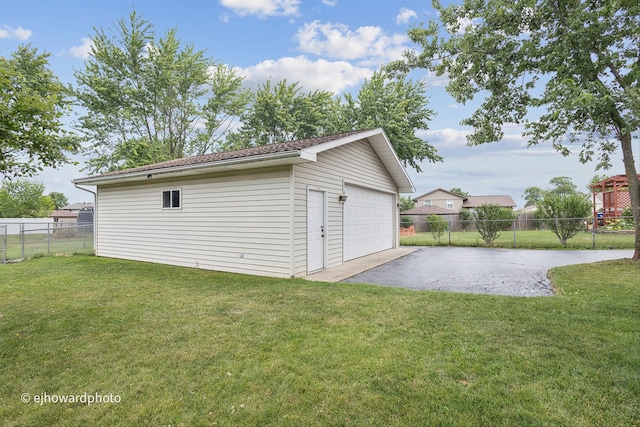 garage featuring a lawn