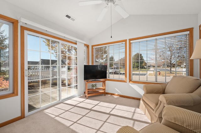 unfurnished living room with ceiling fan, carpet, and lofted ceiling