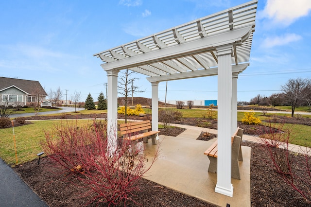 view of property's community with a patio area, a yard, and a pergola