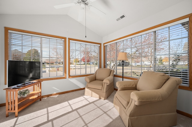 sunroom / solarium featuring ceiling fan and vaulted ceiling