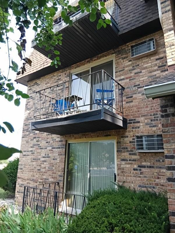 view of property exterior with a balcony