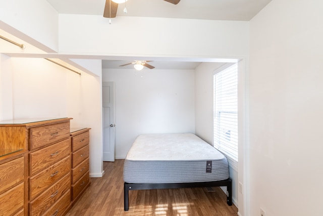 bedroom featuring hardwood / wood-style flooring and ceiling fan