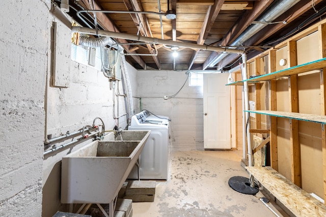 laundry area featuring sink and washer and clothes dryer