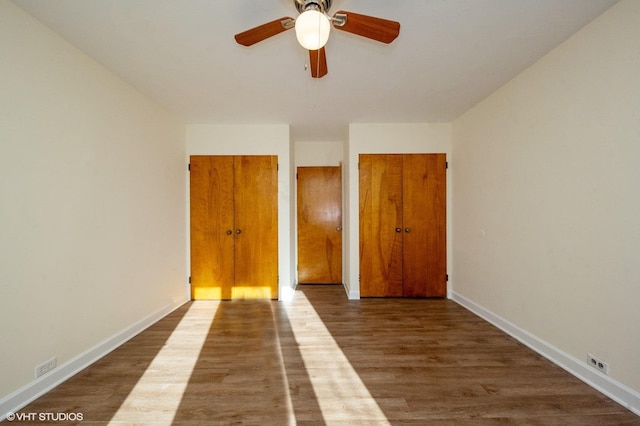 spare room with wood-type flooring and ceiling fan