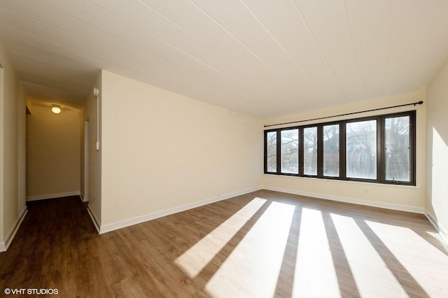 unfurnished room with hardwood / wood-style floors