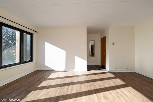 spare room with hardwood / wood-style floors