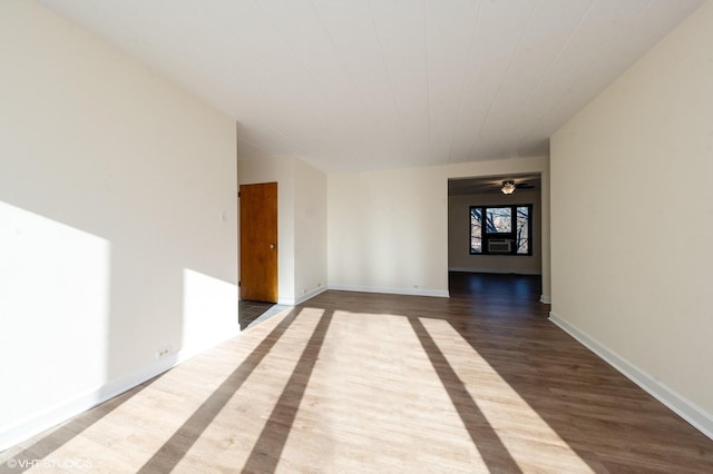 unfurnished room featuring hardwood / wood-style floors and ceiling fan