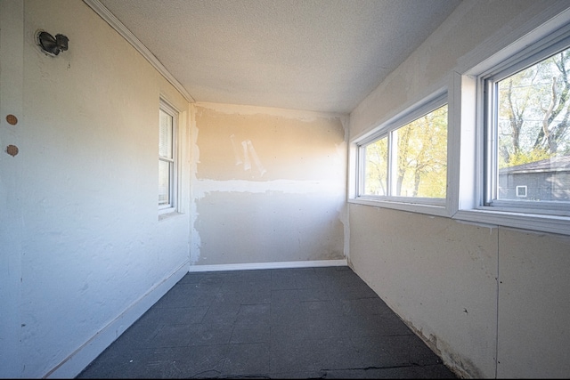 corridor with a textured ceiling