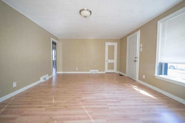 unfurnished room featuring light hardwood / wood-style flooring