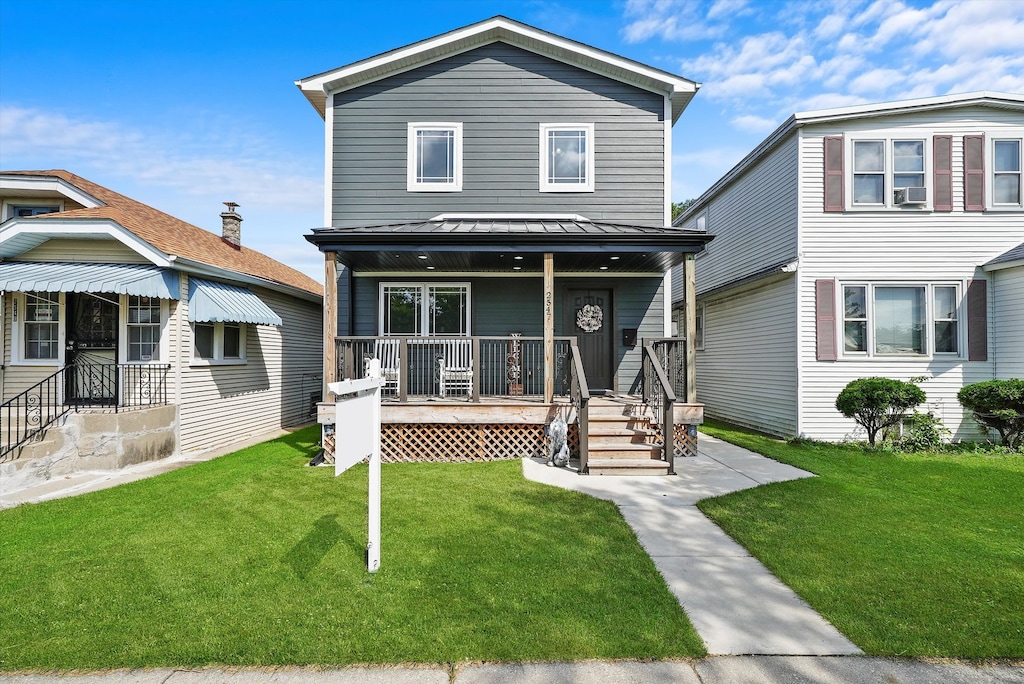 view of front facade featuring cooling unit, a front lawn, and a porch