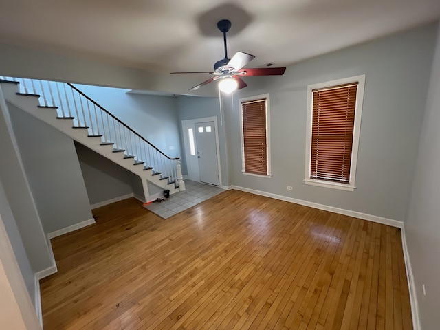 interior space featuring light wood-type flooring and ceiling fan