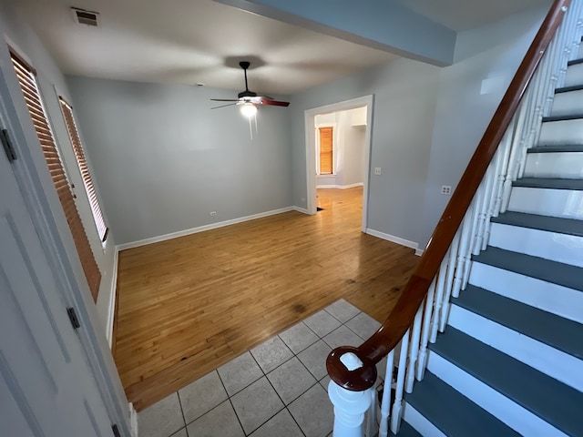 interior space with ceiling fan, a healthy amount of sunlight, and wood-type flooring