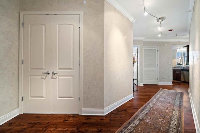 corridor featuring ornamental molding and dark hardwood / wood-style floors