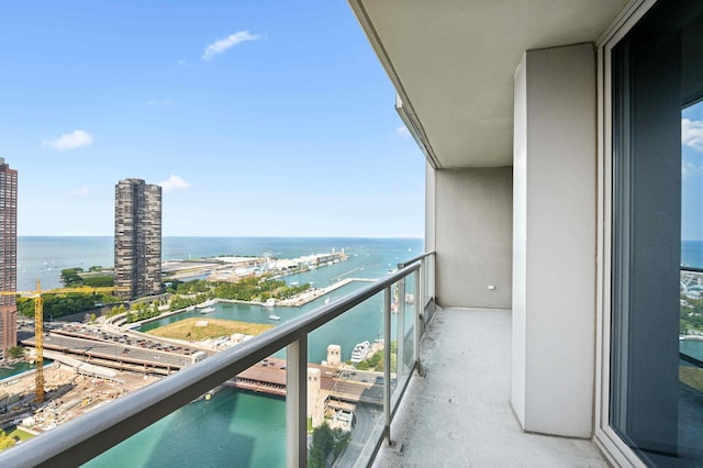 balcony featuring a water view