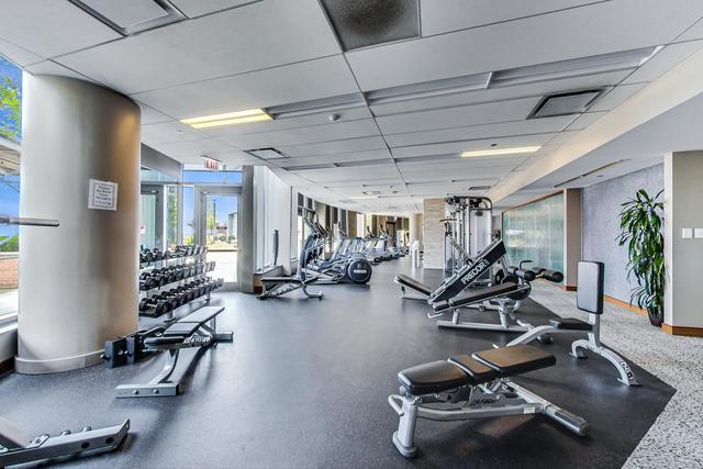 workout area with a drop ceiling