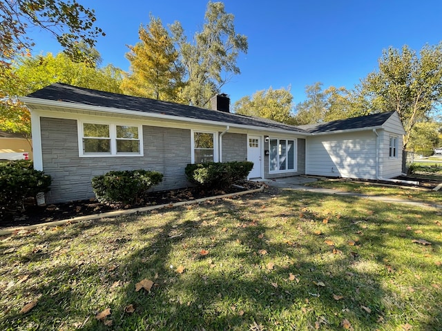 ranch-style house with a front lawn