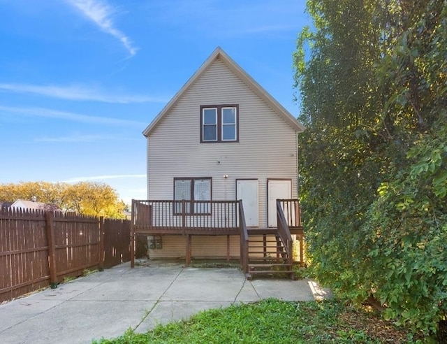 back of property featuring a deck